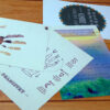 custom made bunch of cards spread over on wooden plank