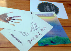 custom made bunch of cards spread over on wooden plank