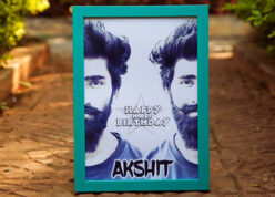 Turquoise color A4 frame with bisected face pictures and name for half birthday.