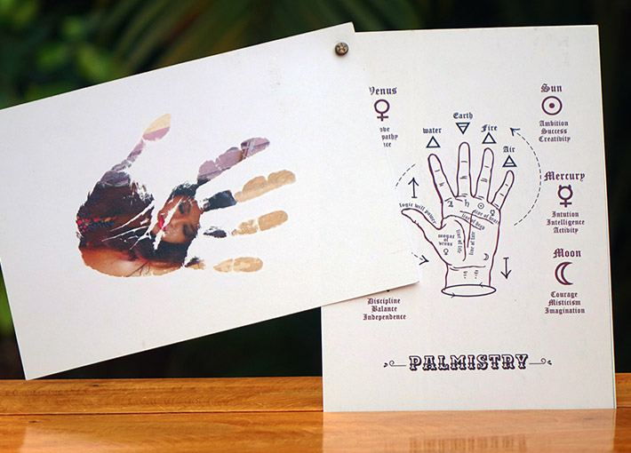 photo clipped into a palm and palmistry printed on thick sheets as greeting card