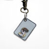 A custom made key chain gift hanging with Name letters with pictures.