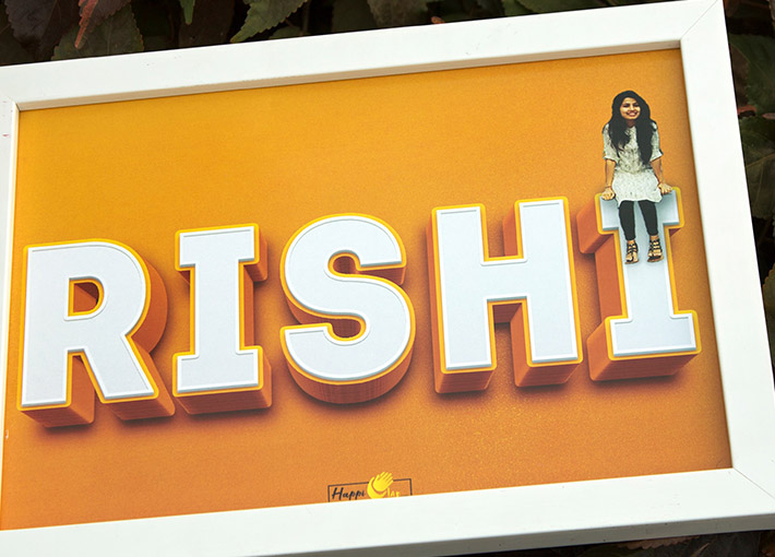 girl sittig on top of her name alphbet edited frame gift with orange background