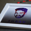 white square frame placed on a sheet with red and black banner in the background