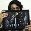 guy holding his photo frame edited in iron throne king theme with his name printed on it