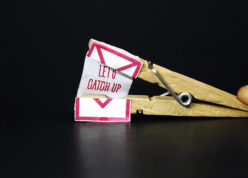 let's catch up message inside a wooden clip
