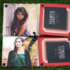 inside view of handmade greeting card with photos and names placed in grass