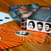 Face logos, name branding, customized pack of cards spread open with case and box