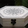 wooden pine box with vintage material and mandala art hand drawn on top it
