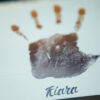 handprint with name edited in a colour gradient