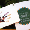 photo inside a handprint and happy birthday card