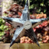 Black and white pictures of a girl on a 3D star with her name card in the center.
