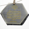 custom message printed with golden letters on butter paper with blue burlap in background