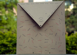 Brown envelope with happiclap stamp all over it and pop letters inside