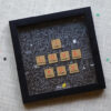 black square proposal frame placed on a sheet with confetti in the background