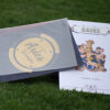 zodiac sign based greeting card lying on ground with grass semi opened