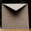 Brown envelope with red and black happiclap brand stamps all over