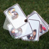 Letters of a name with girl's pictures edited in them on leaves of a key chain..