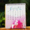 picture printed table calendar placed on table