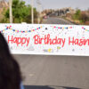 On road banner surprise for a girl