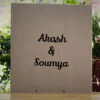 Customized names on brown envelope on a wooden table