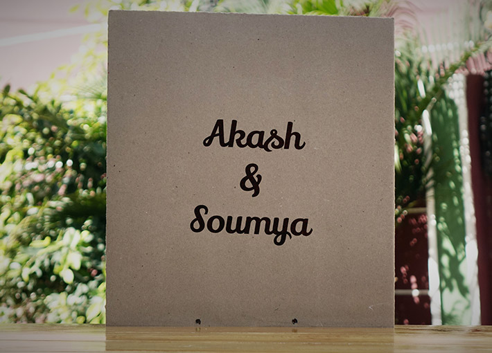 Customized names on brown envelope on a wooden table