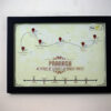 a4 size black frame hanged to a plain wall
