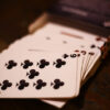 Stack of playing cards falling out of a customized box gift
