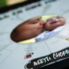 aditya chopra custom name printed on a thick sheet placed inside a black frame